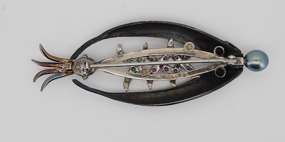 Rachel Jeffrey, a cultured pearl and gem-set brooch, 'The Pearl of the Dee', circa 2000,designed as a fly for fly fishing, set with circular-cut rubies, sapphires and emeralds, topped with a black cultured pearl, mounted